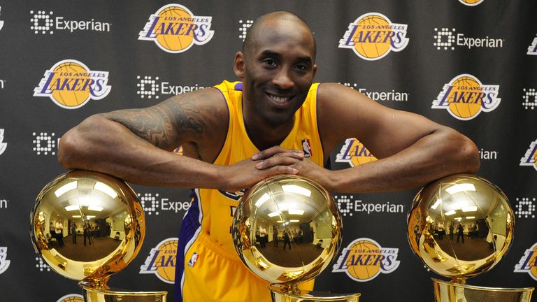 Kobe Bryant poses with the five NBA championships he won as a member of the Los Angeles Lakers
