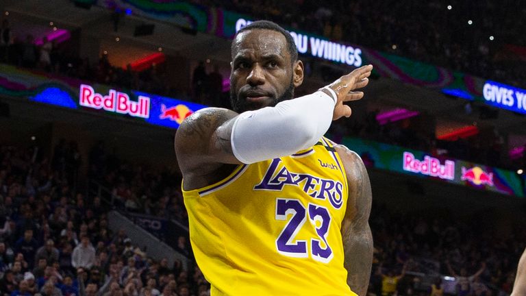 LeBron James #23 of the Los Angeles Lakers reacts in front of Ben Simmons #25 of the Philadelphia 76ers in the fourth quarter at the Wells Fargo Center on January 25, 2020 in Philadelphia, Pennsylvania. The 76ers defeated the Lakers 108-91. 