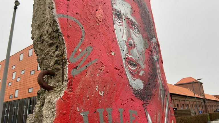 A piece of the Berlin Wall painted with a giant image of Eden Hazard sits outside Lille’s training base 