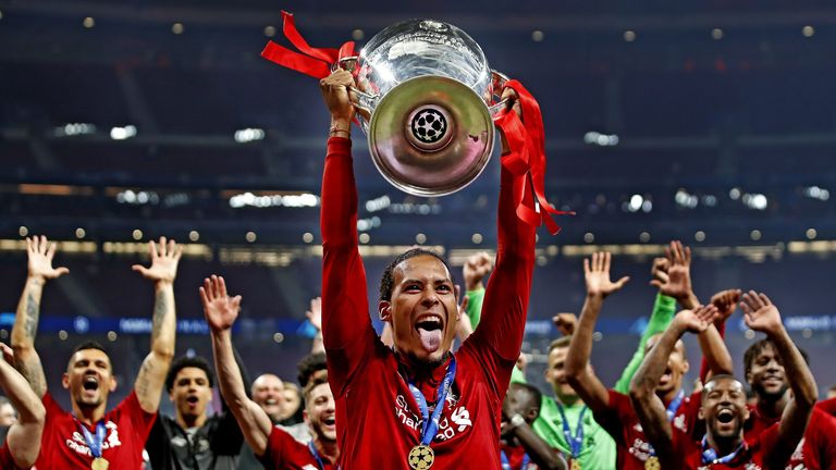 Liverpool defender Virgil van Dijk lifts the Champions League Trophy aloft