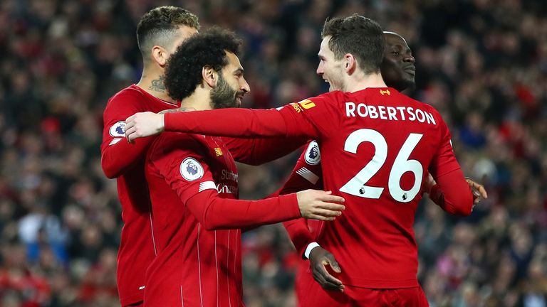 Liverpool players celebrate Mohamed Salah&#39;s opener at Anfield
