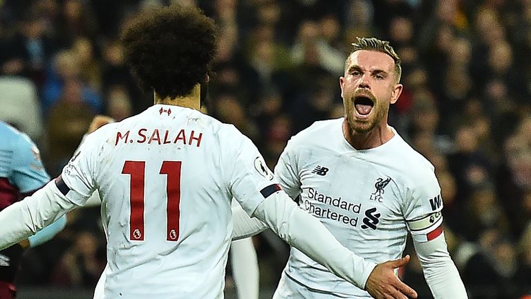 Jordan Henderson celebrates with Mohamed Salah at the London Stadium