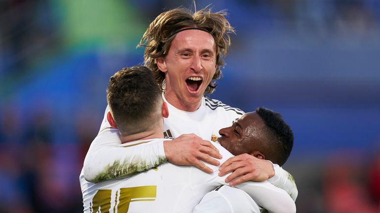 Luka Modric celebrates his goal with team-mates as Real extend their lead