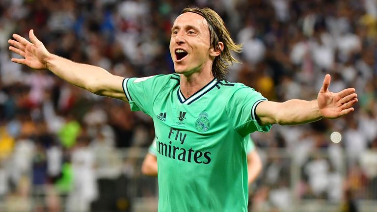 Luka Modric celebrates scoring Real Madrid's third goal