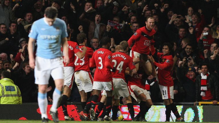 MANCHESTER, ENGLAND - JANUARY 27: Michael Carrick of Manchester United celebrates scoring their second goal during the Carling Cup Semi-Final Second Leg match between Manchester United and Manchester City at Old Trafford on January 27 2010, in Manchester, England. (Photo by Tom Purslow/Manchester United via Getty Images) *** Local Caption *** Michael Carrick;Wayne Rooney