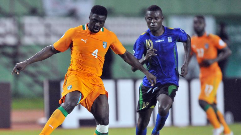 Mbwana Samatta battling with the Ivory Coasts' Kolo Toure whilst playing for Tanzania 