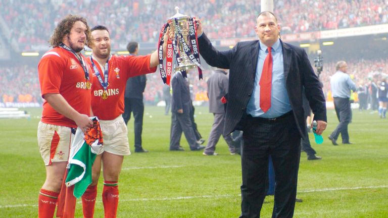 Mike Ruddock (right) the Wales coach together with players Adam Jones and Mefin Davies raise the trophy as Wales' win the Grand Slam after defeating Ireland in the RBS Six Nations International between Wales and Ireland at The Millennium Stadium