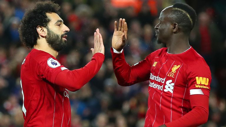 Mohamed Salah of Liverpool celebrates with Sadio Mane after scoring his team's first goal during the Premier League match between Liverpool FC and Sheffield United at Anfield on January 02, 2020 in Liverpool, United Kingdom. (