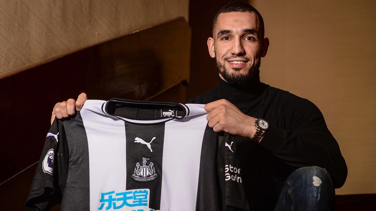 Nabil Bentaleb poses for photos after signing for Newcastle United on loan