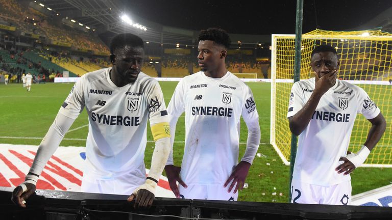 Nantes' players talk with their supporters at the end of the game with Bordeaux