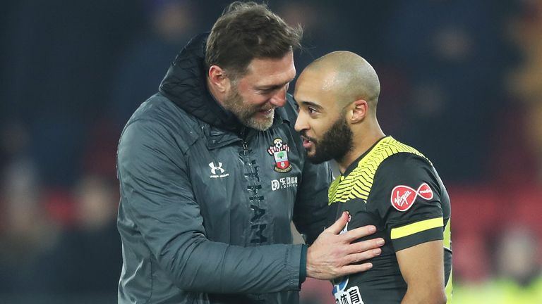 Redmond is congratulated by his manager after a superb display for his side