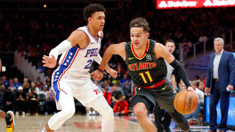 Trae Young #11 of the Atlanta Hawks drives to the basket as he is defended by Matisse Thybulle #22 of the Philadelphia 76ers during the second half of an NBA game at State Farm Arena on January 30, 2020 in Atlanta, Georgia. 