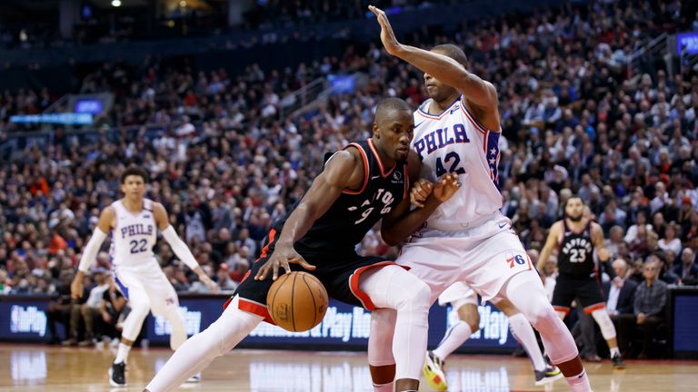 : Serge Ibaka #9 of the Toronto Raptors drives to the net against Al Horford #42 of the Philadelphia 76ers during second half of their NBA game at Scotiabank Arena on January 22, 2020 in Toronto, Canada. 