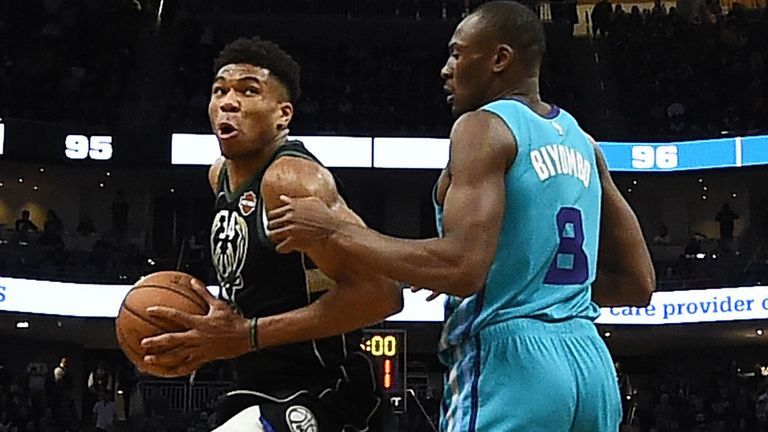 Giannis Antetokounmpo attacks the basket defended by Bismack Biyombo