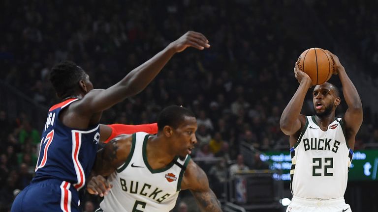  Khris Middleton #22 of the Milwaukee Bucks takes a three point shot during the first half of a game against the Washington Wizards at Fiserv Forum on January 28, 2020 in Milwaukee, Wisconsin.
