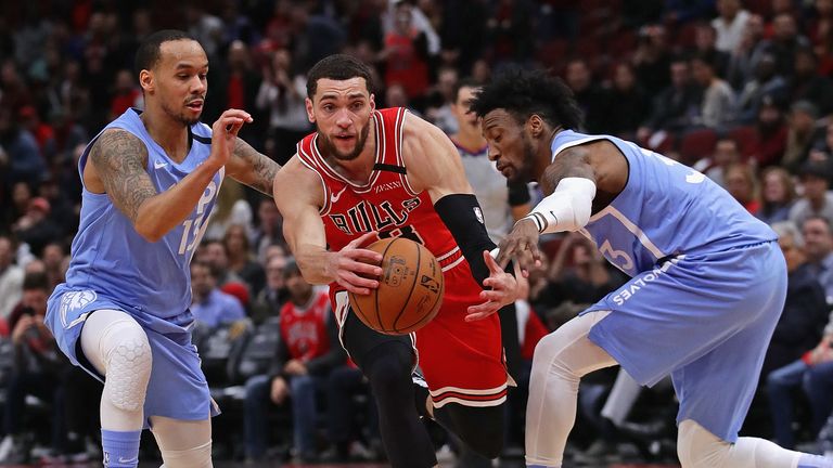 Robert Covington #33 of the Minnesota Timberwolves (R) knocks the ball away from Zach LaVine #8 of the Chicago Bulls as he drives past Shabazz Napier #13 at the United Center on January 22, 2020 in Chicago, Illinois. 