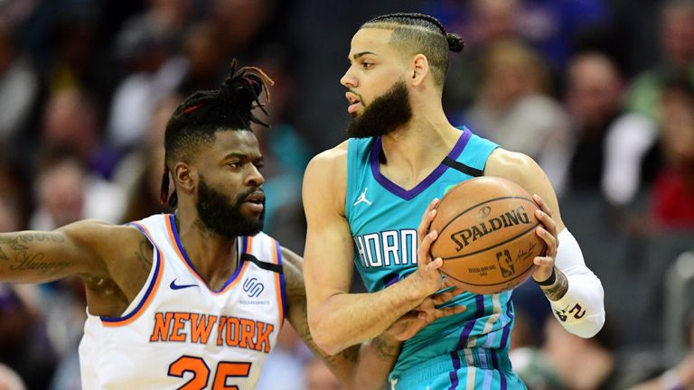 Reggie Bullock #25 of the New York Knicks defends Cody Martin #11 of the Charlotte Hornets during the second quarter at Spectrum Center on January 28, 2020 in Charlotte, North Carolina. 