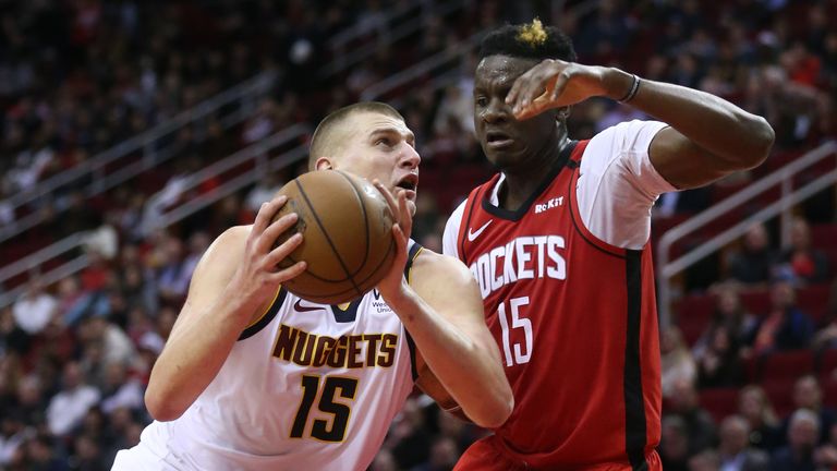 Nikola Jokic #15 of the Denver Nuggets drives on Clint Capela #15 of the Houston Rockets during the fourth quarter at Toyota Center on January 22, 2020 in Houston, Texas.