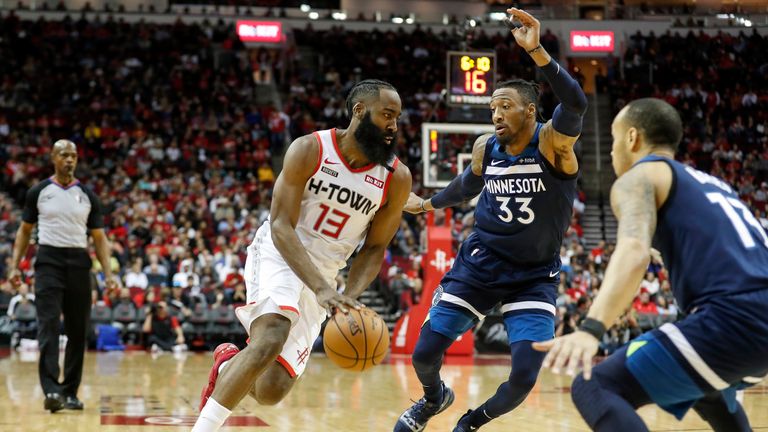 James Harden #13 of the Houston Rockets drives to the basket defended by Robert Covington #33 of the Minnesota Timberwolves in the first half at Toyota Center on January 11, 2020 in Houston, Texas. 