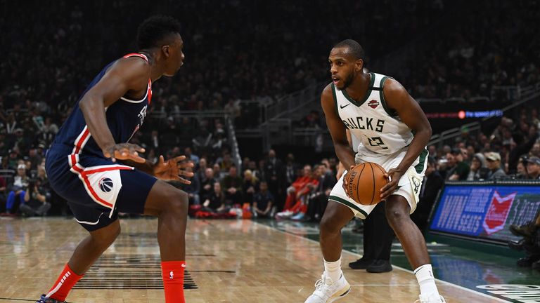 Khris Middleton #22 of the Milwaukee Bucks is defended by Thomas Bryant #13 of the Washington Wizards during the first half at Fiserv Forum on January 28, 2020 in Milwaukee, Wisconsin.