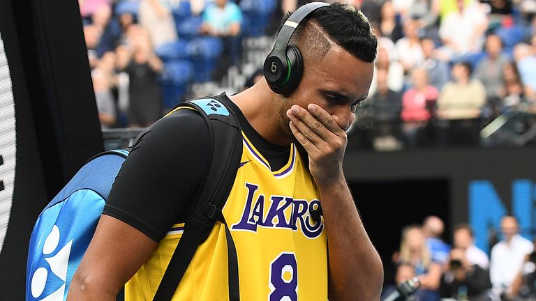 Nick Kyrgios of Australia tears up as he walks onto Rod Laver Arena wearing a number 8 Kobe Bryant Jersey ahead of his Men's Singles fourth round match against Rafael Nadal of Spain on day eight of the 2020 Australian Open at Melbourne Park on January 27, 2020 in Melbourne, Australia