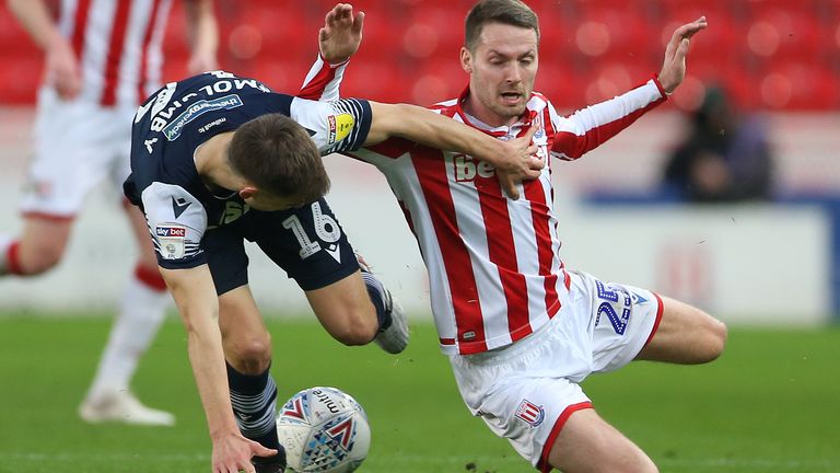 Stoke City's Nick Powell and Millwall's Jayson Molumby in action at the bet365 Stadium