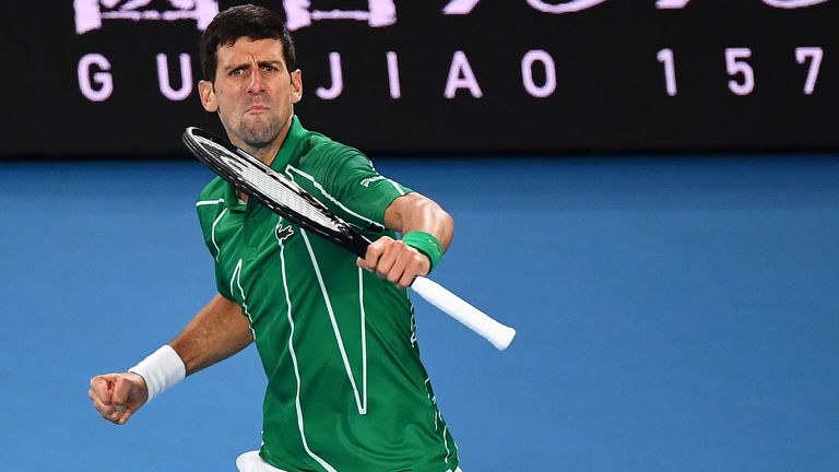 Serbia's Novak Djokovic celebrates a point against Canada's Milos Raonic during their men's singles quarter-final match on day nine of the Australian Open tennis tournament in Melbourne on January 28, 2020. 