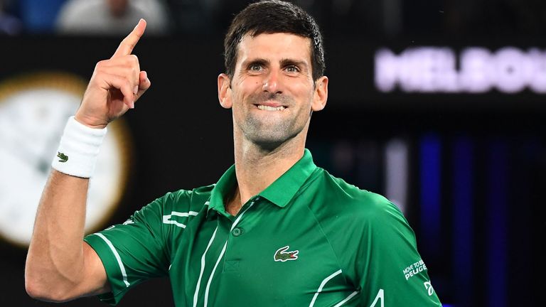 Serbia's Novak Djokovic celebrates after beating Switzerland's Roger Federer during their men's singles semi-final match on day eleven of the Australian Open tennis tournament in Melbourne on January 30, 2020.