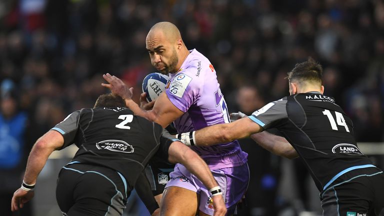 Exeter's Olly Woodburn  is tackled by Fraser Brown