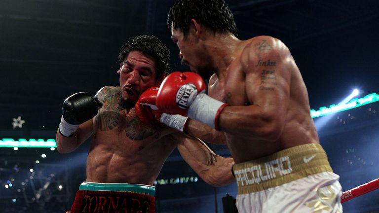 Manny Pacquiao (white trunks) of the Philippines fights against Antonio Margarito (black trunks) of Mexico during their WBC World Super Welterweight Title bout at Cowboys Stadium on November 13, 2010 in Arlington, Texas.