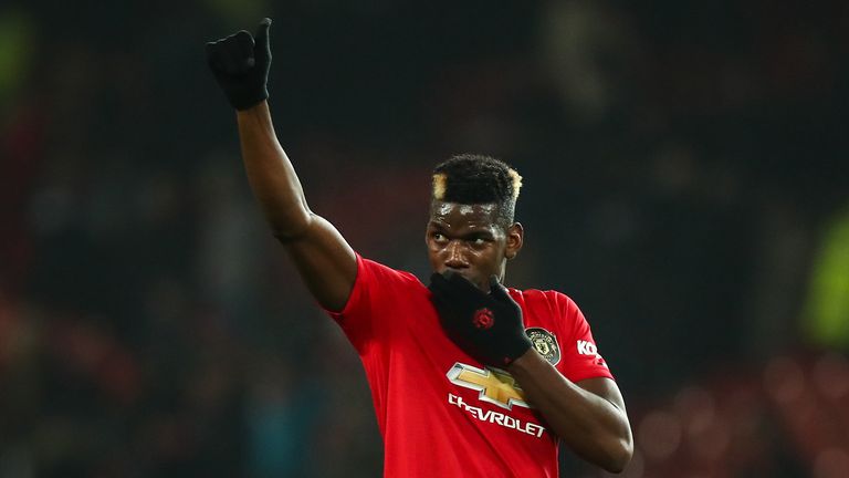 Paul Pogba of Manchester United waves to the fans at full time during the Premier League match between Manchester United and Newcastle United at Old Trafford on December 26, 2019 in Manchester, United Kingdom.