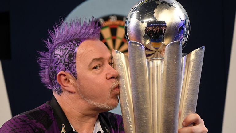 Peter Wright poses with the Sid Waddell William Hill World Darts Championship Trophy after victory in the Final of the 2020 William Hill World Darts Championship between Peter Wright and Michael van Gerwen at Alexandra Palace on December 31, 2019 in London, England