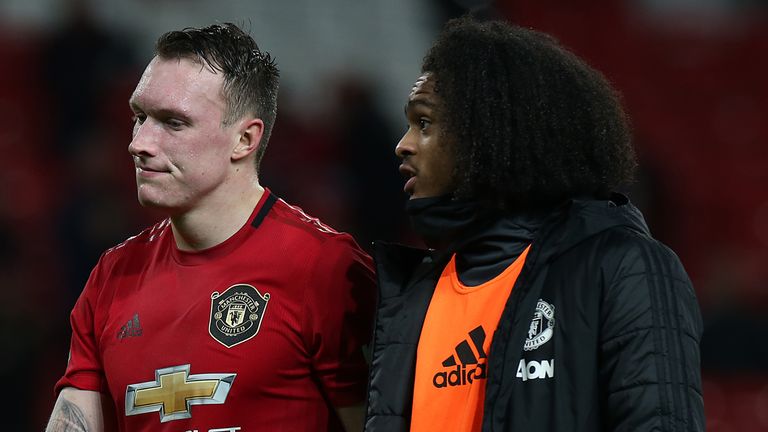 Phil Jones and Tahith Chong trudge off the Old Trafford pitch following the defeat