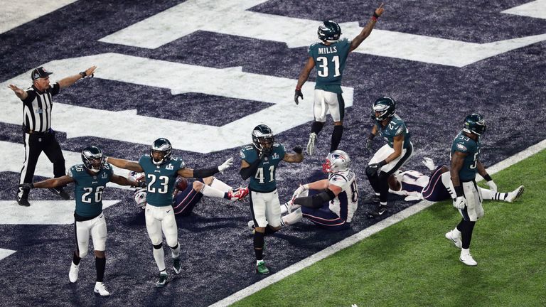 Kelce and Johnson watched from the sideline as the Eagles secured the win on the final play of the game
