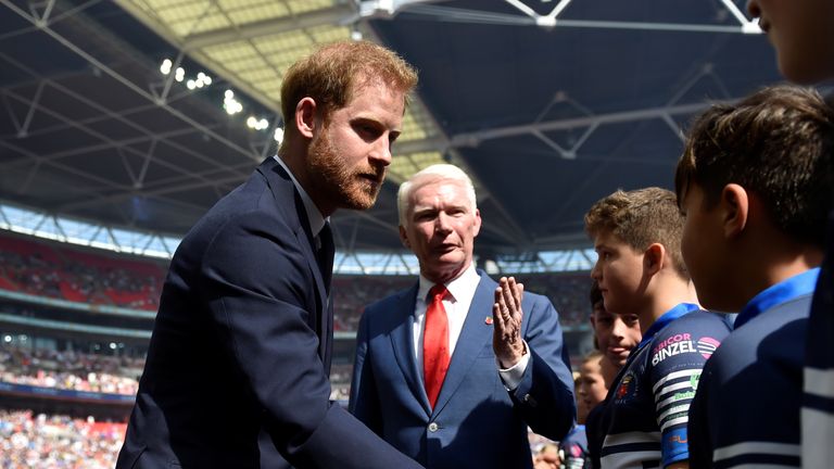Prince Harry met the teams before the Challenge Cup final between St Helens and Warrington Wolves and later presented the trophy to Warrington