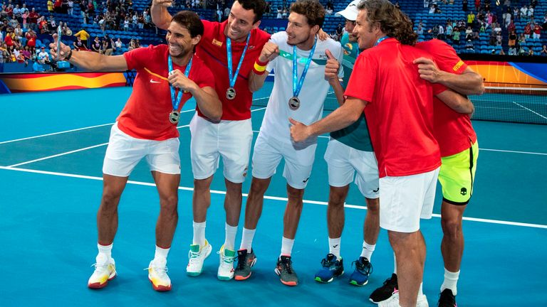 Rafael Nadal of Spain (L) takes a team selfie after receiving their medals for qualifying for the finals by defeating Japan in the 11th session men's singless and doubles matches on day six of the ATP Cup tennis tournament in Perth on January 8, 2020. 