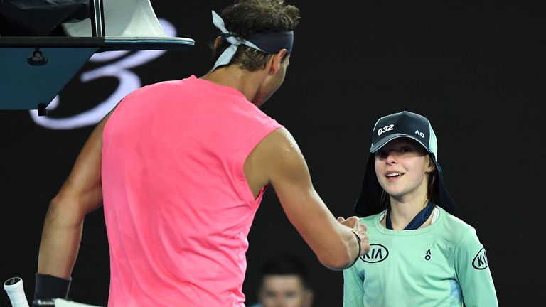 Spain's Rafael Nadal speaks with a ball kid who was hit by the ball in his men's singles match against Argentina's Federico Delbonis on day four of the Australian Open tennis tournament in Melbourne on January 23, 2020.
