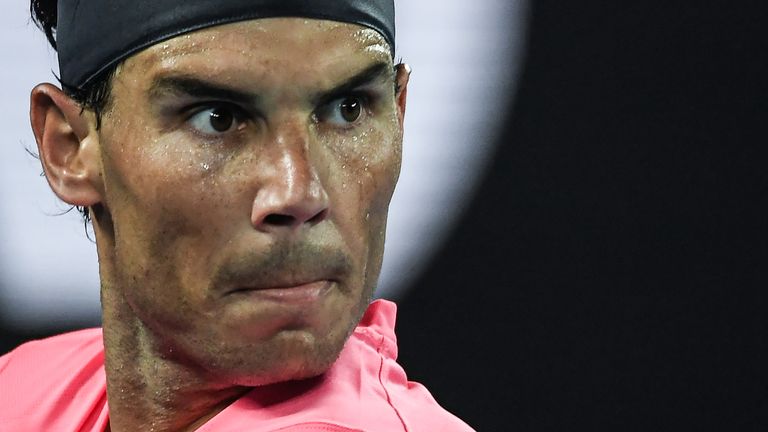 Spain's Rafael Nadal eyes a return against Australia's Nick Kyrgios during their men's singles match on day eight of the Australian Open tennis tournament in Melbourne on January 27, 2020. 