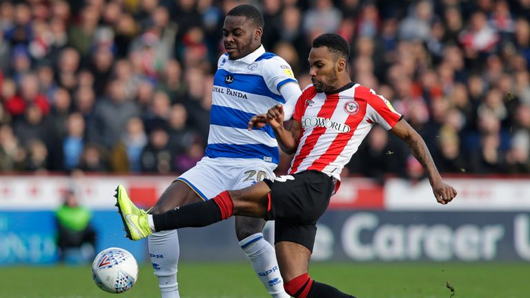 Brentford's Rico Henry challenges Bright Osayi-Samuel of QPR