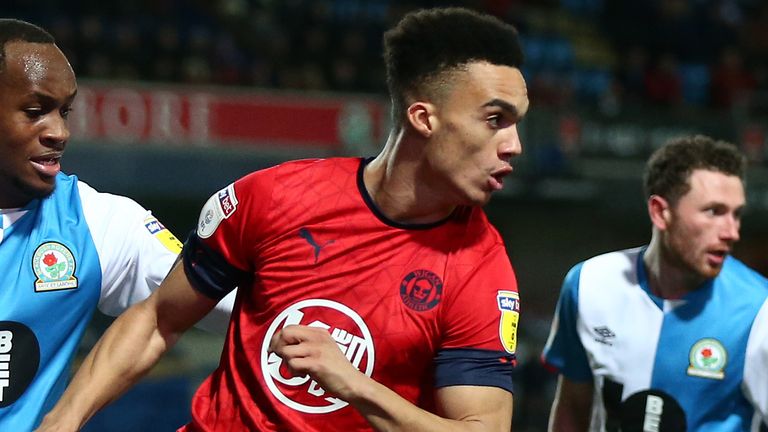 Antonee Robinson of Wigan Athletic turns away from Ryan Nyambe of Blackburn Rovers during the Sky Bet Championship match between Blackburn Rovers and Wigan Athletic at Ewood Park on December 23, 2019