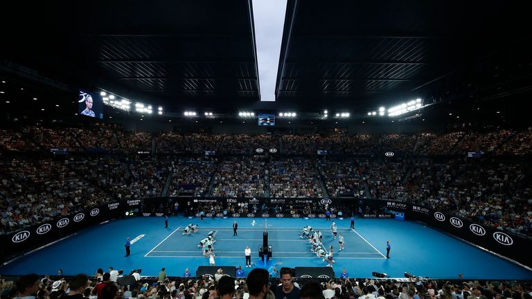 The roof closes as ballkids wipe rain off the court forcing a short delay during the Men's Singles Semifinal match between Dominic Thiem of Austria and Alexander Zverev of Germany on day twelve of the 2020 Australian Open at Melbourne Park on January 31, 2020 in Melbourne, Australia. 