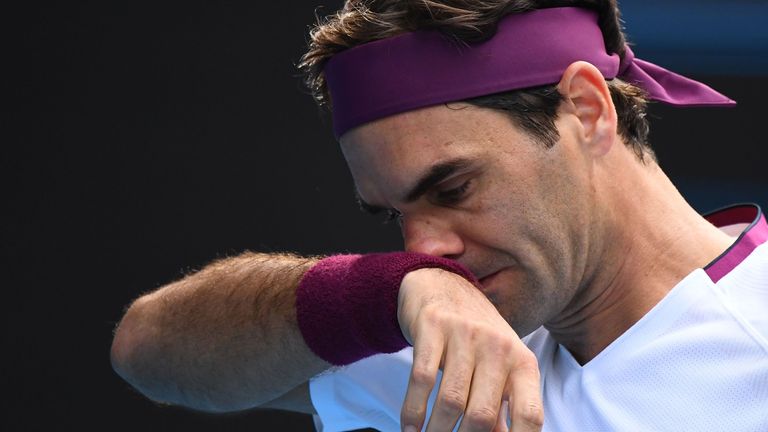 Switzerland's Roger Federer reacts after a point against Tennys Sandgren of the US during their men's singles quarter-final match on day nine of the Australian Open tennis tournament in Melbourne on January 28, 2020