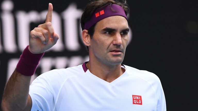 Switzerland's Roger Federer celebrates a point against Tennys Sandgren of the US during their men's singles quarter-final match on day nine of the Australian Open tennis tournament in Melbourne on January 28, 2020