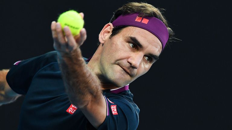 Switzerland's Roger Federer serves against Serbia's Novak Djokovic during their men's singles semi-final match on day eleven of the Australian Open tennis tournament in Melbourne on January 30, 2020.