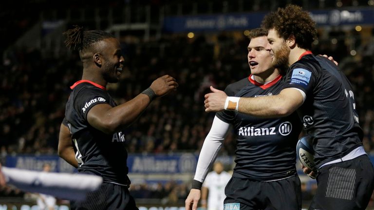 BARNET, ENGLAND - JANUARY 04: Duncan Taylor of Saracens celebrates with team mates Rotimi Segun (l) and Ben Spencer (c) as Jono Lance of Worcester Warriors looks on during the Gallagher Premiership Rugby match between Saracens and Worcester Warriors at Allianz Park on January 4, 2020 in Barnet, England. (Photo by Henry Browne/Getty Images)