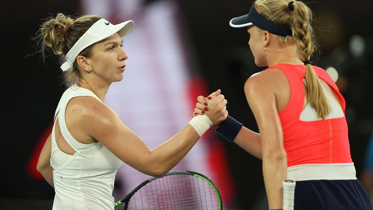 Simona Halep of Romania (L) shakes hands with Harriet Dart of Great Britain at the net after the Women's Singles second round match on day four of the 2020 Australian Open at Melbourne Park on January 23, 2020 in Melbourne, Australia.
