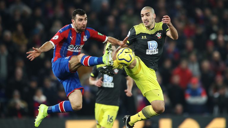 Oriol Romeu competes for the ball with James McArthur at Selhurst Park