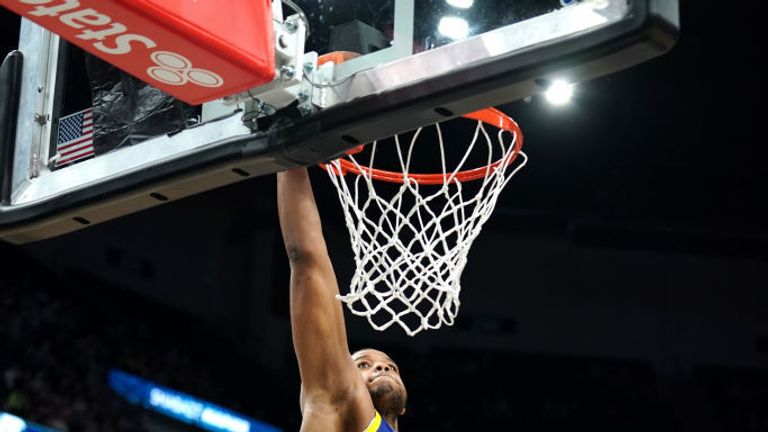  Omari Spellman #4 of the Golden State Warriors goes up for a dunk during a game against the Minnesota Timberwolves on January 2, 2020 at Target Center in Minneapolis, Minnesota. 