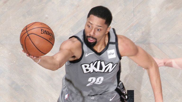 Spencer DInwiddie elevates to score at the rim