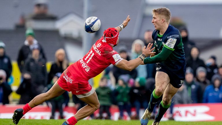 Connacht's Stephen Kerins looks to get a pass away despite the attentions of Cheslin Kolbe